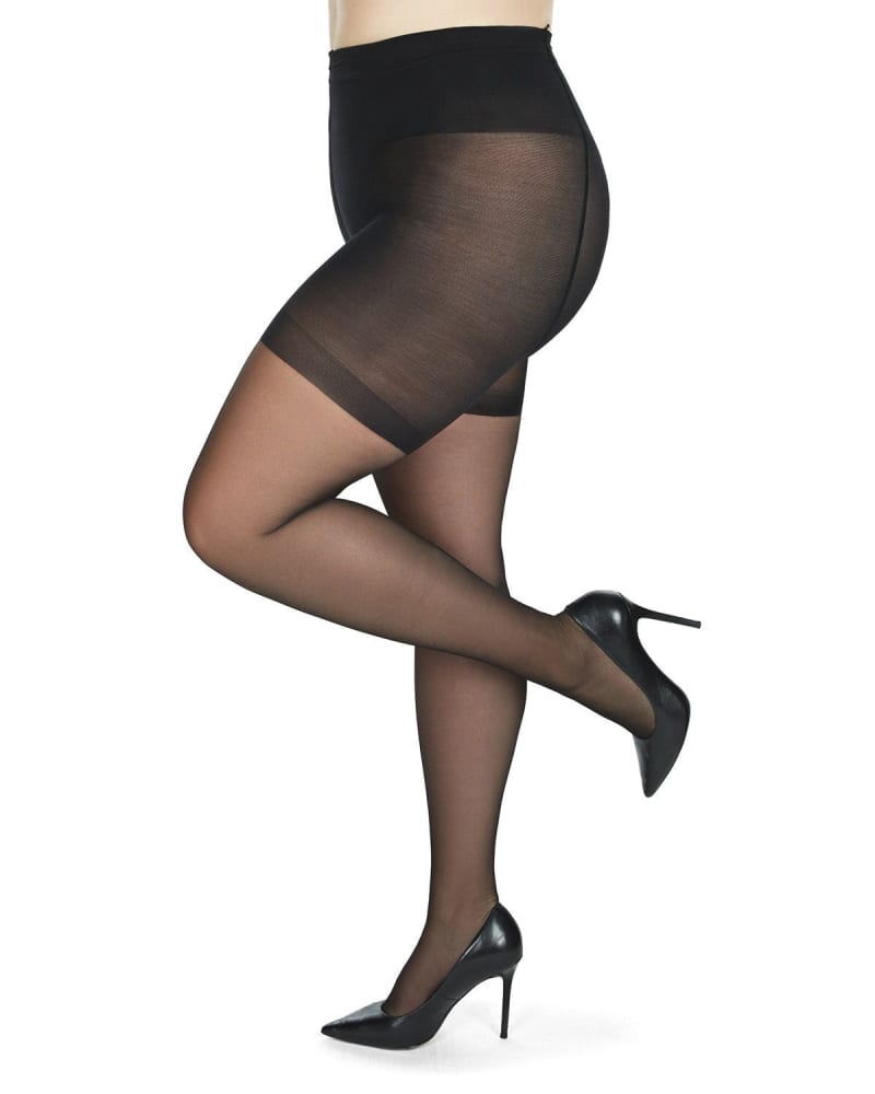 Side of a model wearing a size Q1 Crystal Sheer Shaper Control Top Tights in Black by Memoi. | dia_product_style_image_id:299840